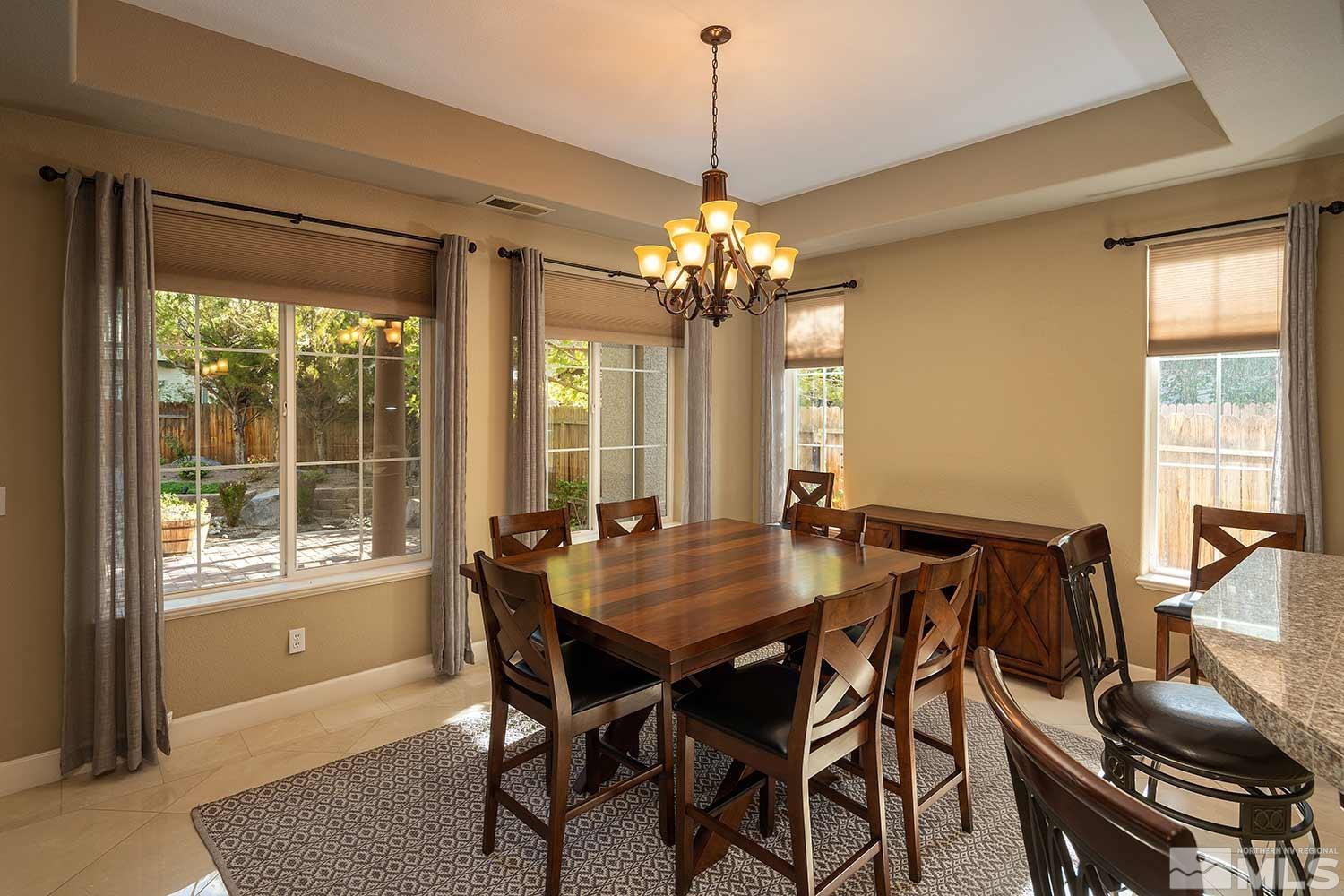 1861 Braemore Drive Reno, NV 89521 - Photo 6 of 40 a view of a dining room with furniture window and outside view