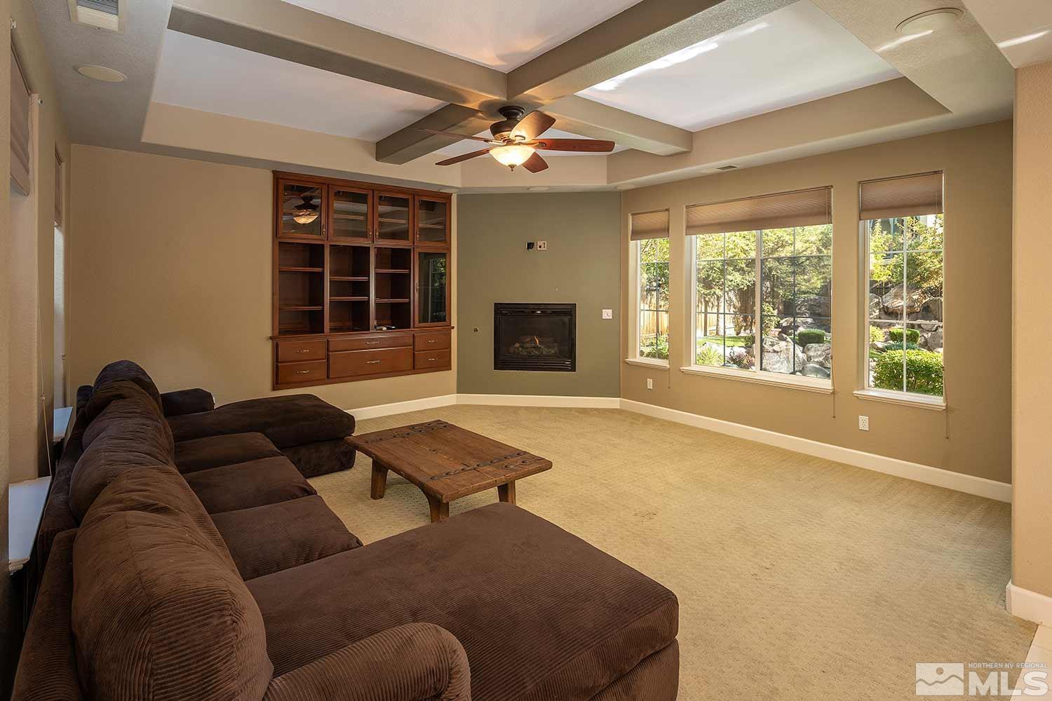 1861 Braemore Drive Reno, NV 89521 - Photo 9 of 40 a living room with furniture and a fireplace