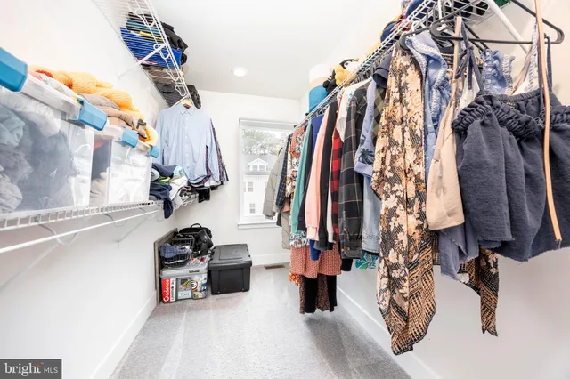 a view of a house with a small yard and a trees