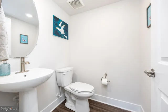 a front view of building with yard and green space