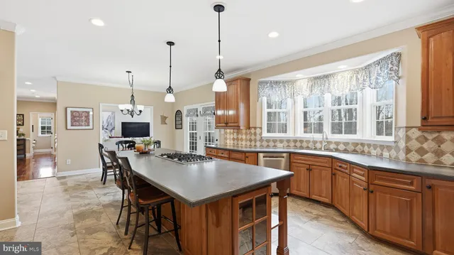 a kitchen with lots of counter top space and dining table