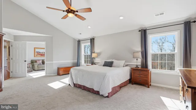 a bedroom with a bed furniture and window