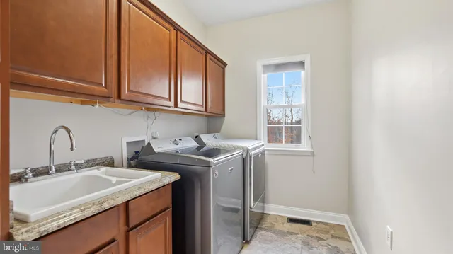 a view of bathroom with dual sinks
