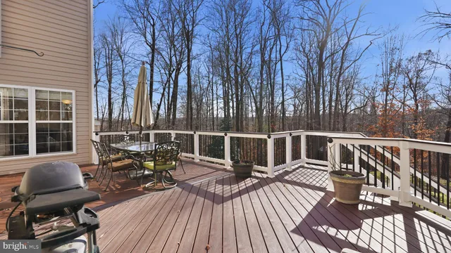 a view of balcony with chairs and wooden floor