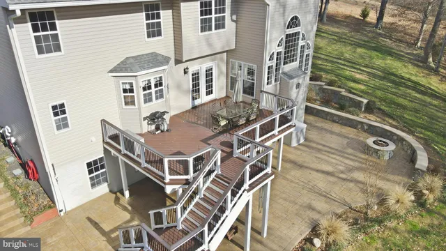 a outdoor space with a stove and chairs