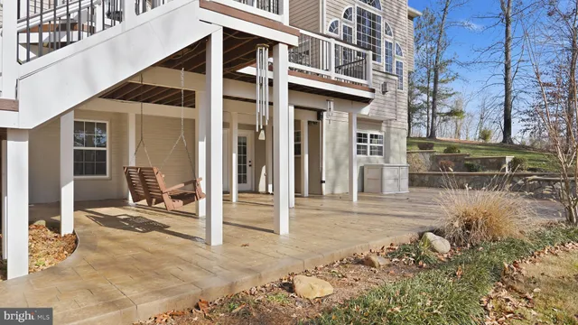 a view of a building with wooden floor and a bench