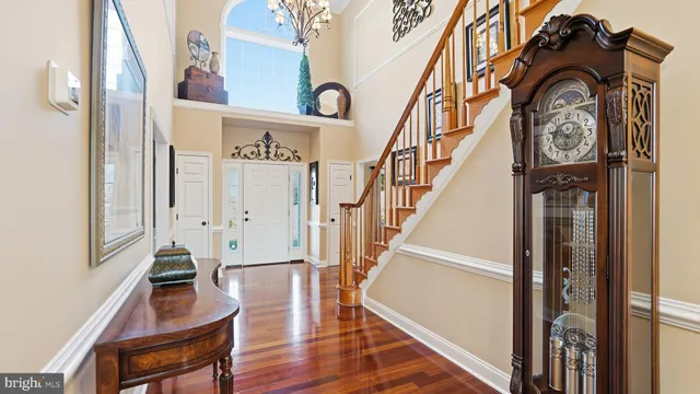 a view of an entryway with wooden floor and door