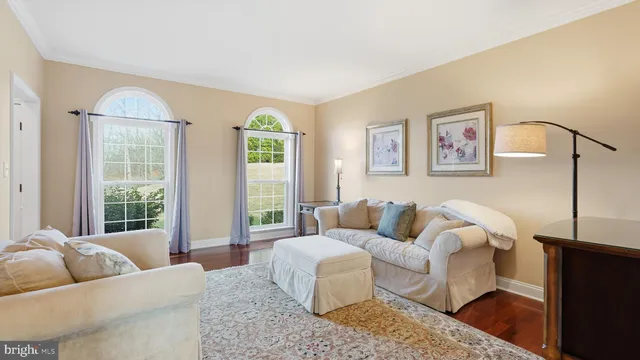 a living room with furniture and windows