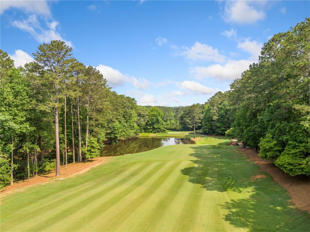 235 Brock Trail Milton, GA 30004 - Photo 26 of 31 a swimming pool with trees in the background