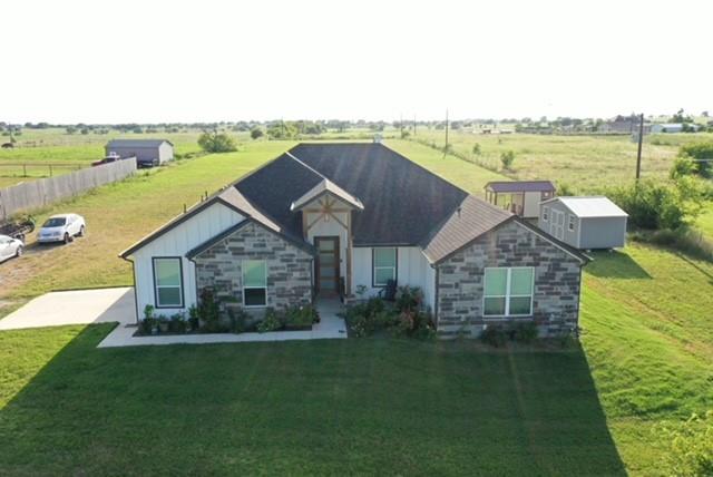351 Mesa Ridge Decatur, TX 76234 - Photo 3 of 29 View of front facade with stone siding, a view of rural / pastoral area, a front yard, and board and batten siding