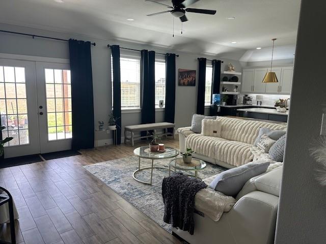 351 Mesa Ridge Decatur, TX 76234 - Photo 5 of 29 Living room featuring wood finished floors, a ceiling fan, french doors, recessed lighting, and vaulted ceiling