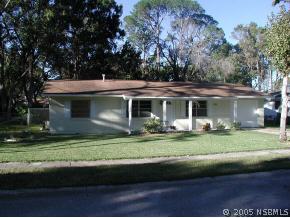 568 Lambright Road Daytona Beach, FL 32119 - Photo 1 of 6 a front view of a house with a garden