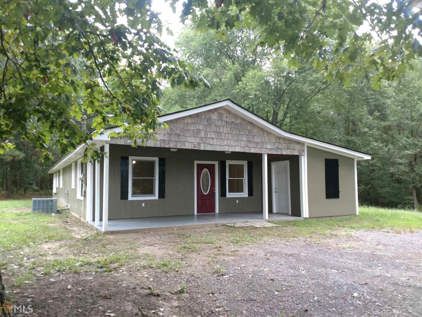 153 Everett Springs Road Northeast, Unit 2 Rome, GA 30165 - Photo 1 of 1 a front view of a house with a garden