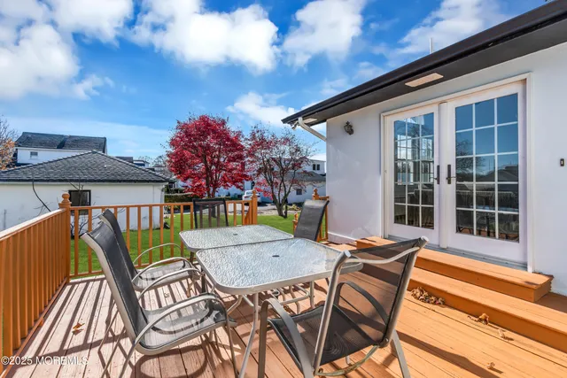 a view of a patio with a table and chairs