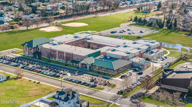 an aerial view of a house with a ocean view