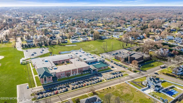an aerial view of a house with a ocean view