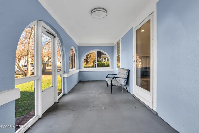 a view of hall way with furniture