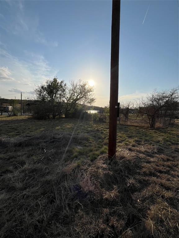 310 North Lakeside Circle May, TX 76857 - Photo 2 of 8 a view of a yard with wooden fence