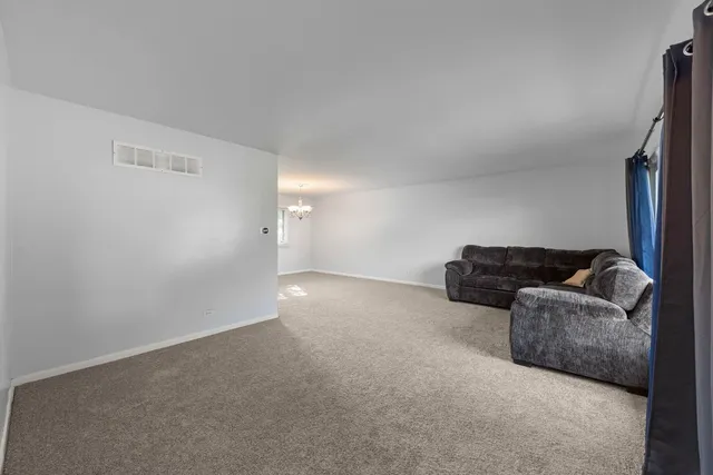 a living room with furniture and a couch