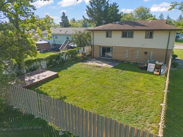 a view of house with backyard porch and furniture