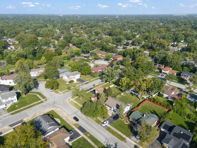 an aerial view of residential houses with outdoor space
