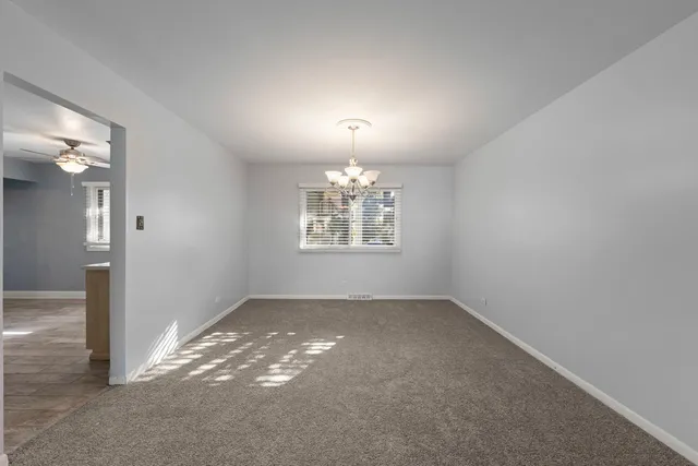an empty room that has a window in it