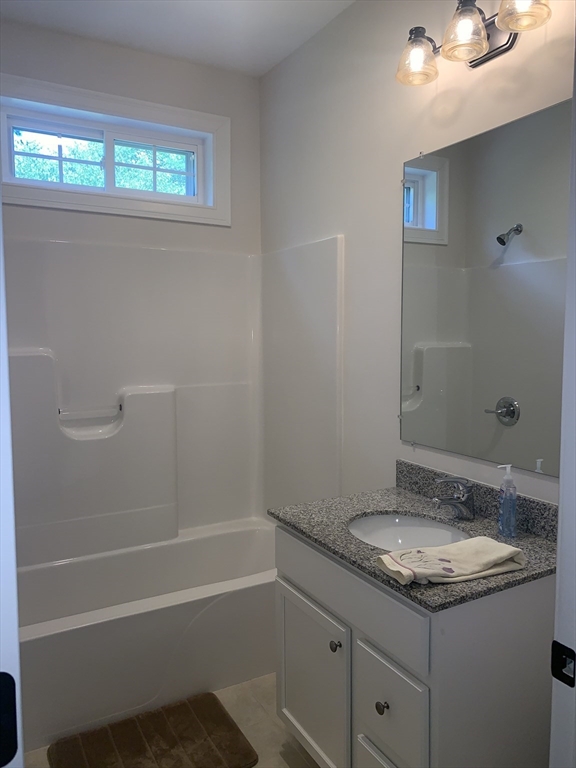 170 Pratt Pond Road Mason, NH 03048 - Photo 21 of 31 a bathroom with a granite countertop sink toilet and shower