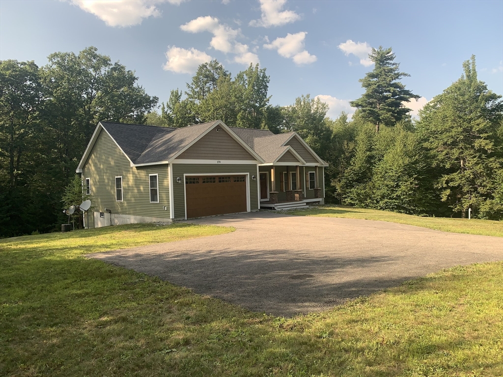 170 Pratt Pond Road Mason, NH 03048 - Photo 4 of 31 a front view of a house with a yard
