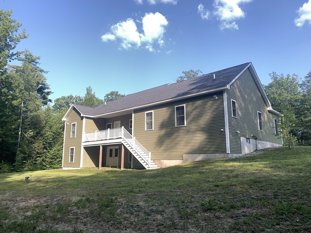 170 Pratt Pond Road Mason, NH 03048 - Photo 7 of 31 a front view of house with yard and trees in the background