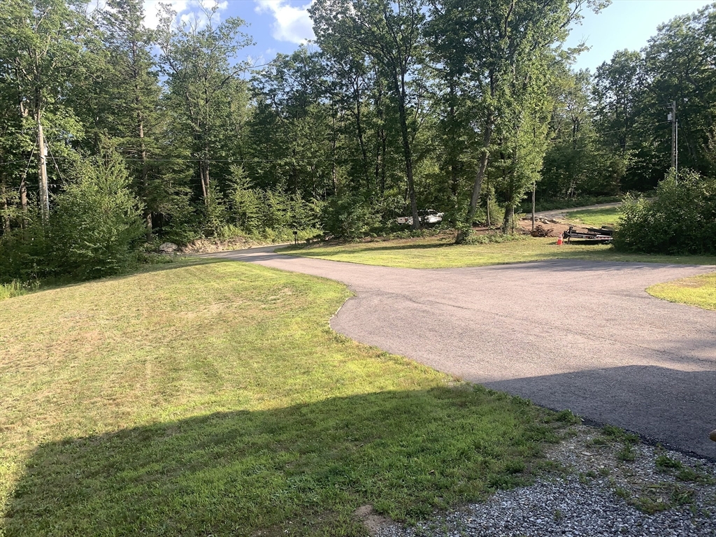 170 Pratt Pond Road Mason, NH 03048 - Photo 8 of 31 a view of a swimming pool with an outdoor space and seating area