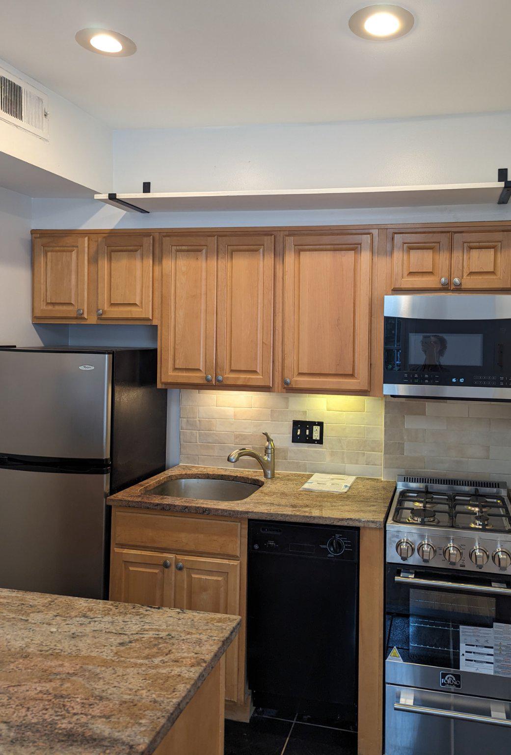726 6th Street Northeast, Unit 1 Washington, DC 20002 - Photo 12 of 27 Fridge, sink, oven, microwave.