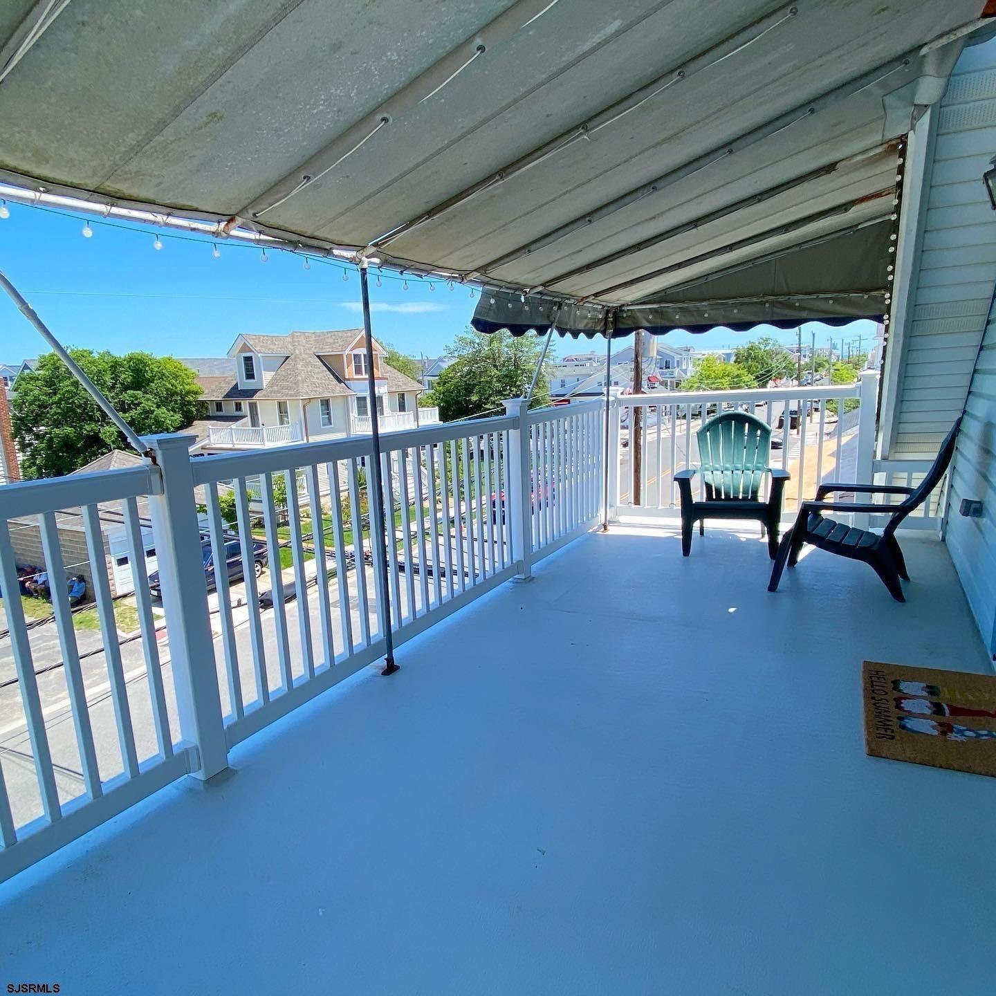 608 1st Street, Unit 3 Ocean City, NJ 08226 - Photo 2 of 13 a view of a porch with furniture