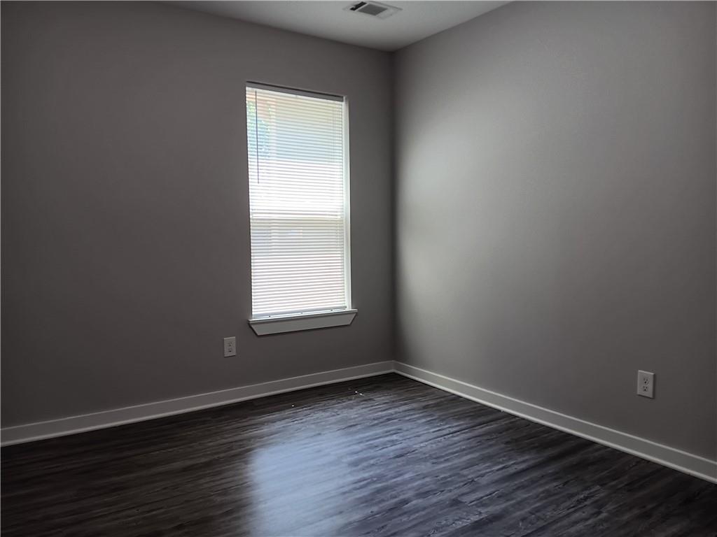 1112 Regent Street Southwest, Unit 1 Atlanta, GA 30310 - Photo 11 of 20 an empty room with wooden floor and windows