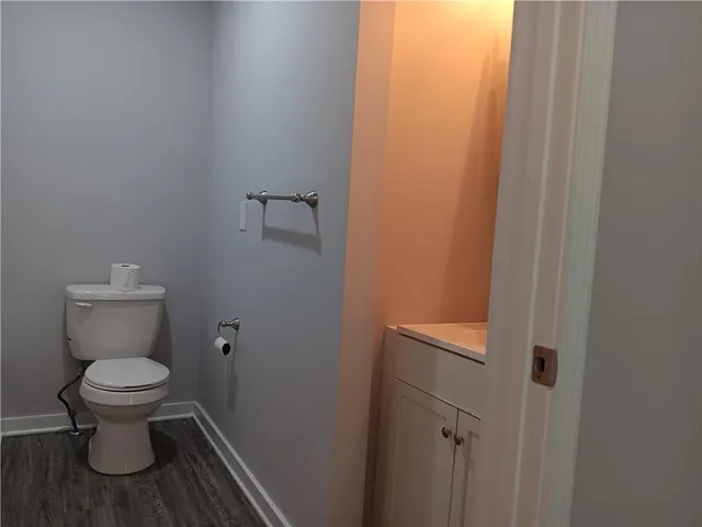 a white bath tub sitting next to a toilet