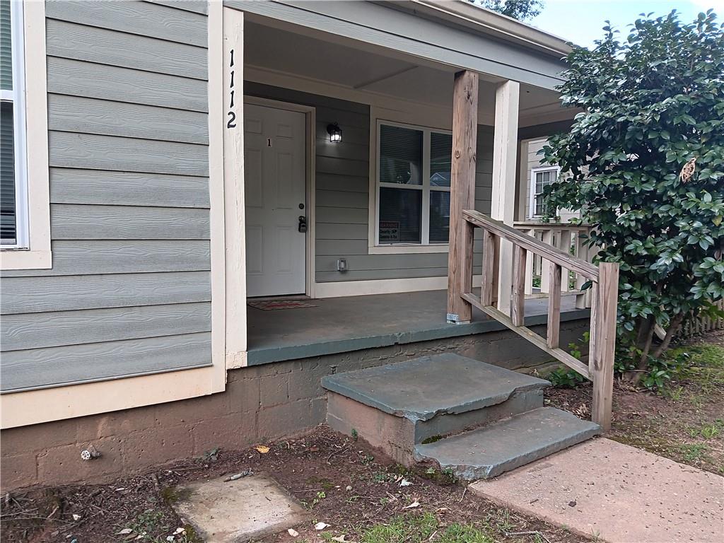 1112 Regent Street Southwest, Unit 1 Atlanta, GA 30310 - Photo 2 of 20 a view of a house with a wooden fence and a window