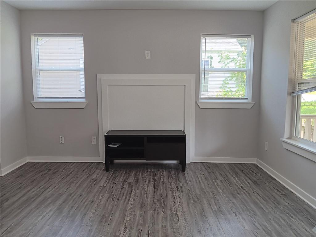 1112 Regent Street Southwest, Unit 1 Atlanta, GA 30310 - Photo 3 of 20 an empty room with wooden floor and window