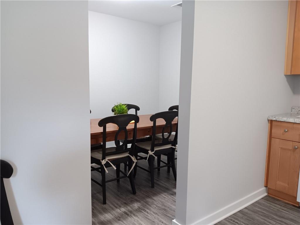 1112 Regent Street Southwest, Unit 1 Atlanta, GA 30310 - Photo 8 of 20 a view of a dining room with furniture and wooden floor