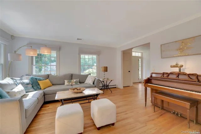 a view of a dining room with furniture wooden floor and chandelier