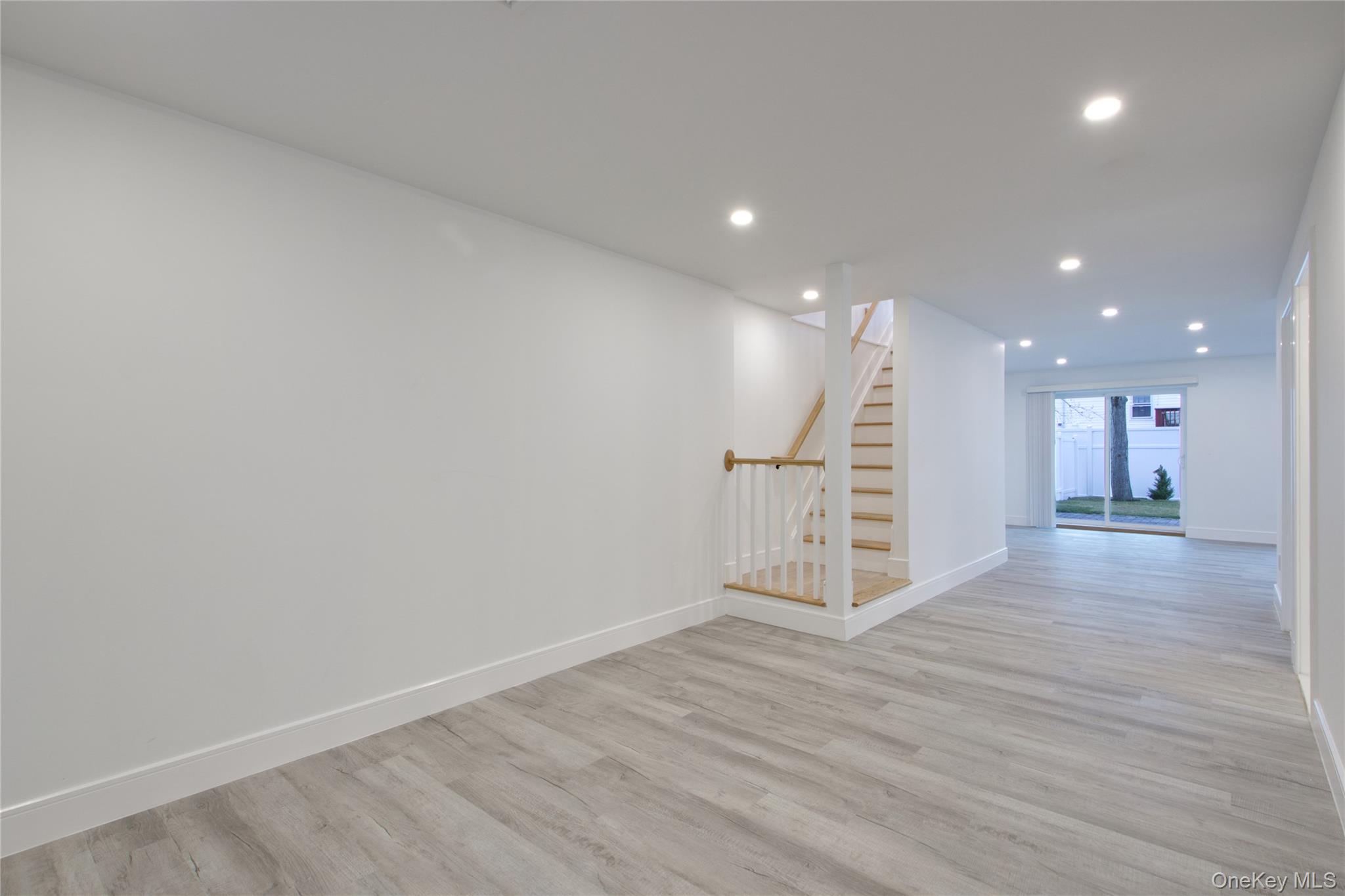 56 Kirkwood Road Port Washington, NY 11050 - Photo 19 of 46 a view of a room with wooden floor
