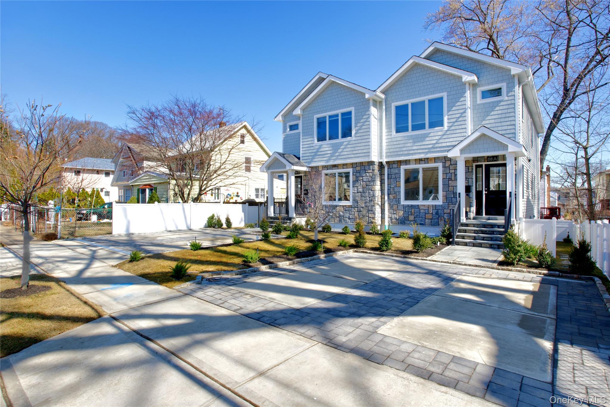 56 Kirkwood Road Port Washington, NY 11050 - Photo 2 of 46 a view of a house with swimming pool and sitting area