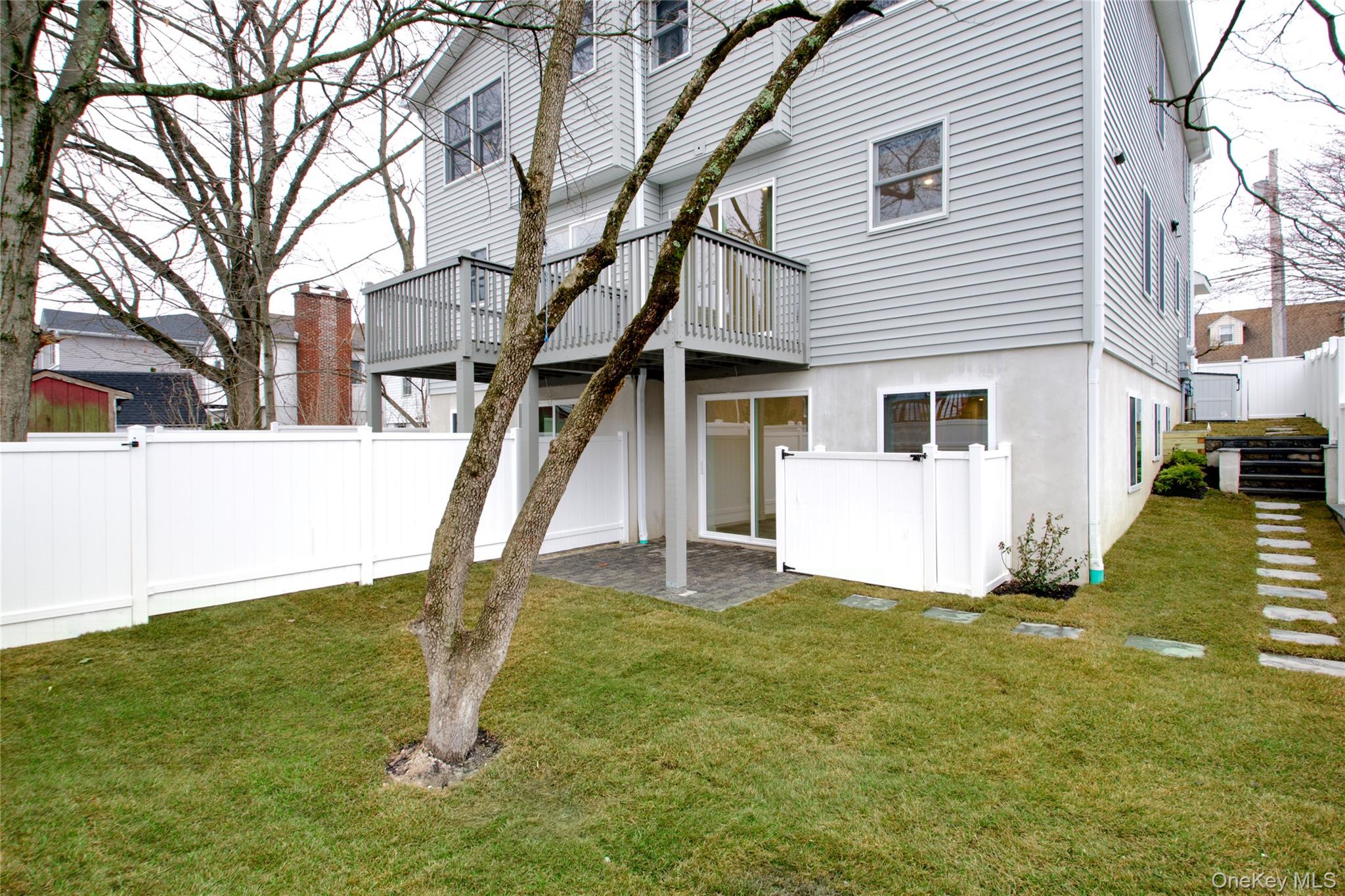 56 Kirkwood Road Port Washington, NY 11050 - Photo 41 of 46 a view of a house with a yard
