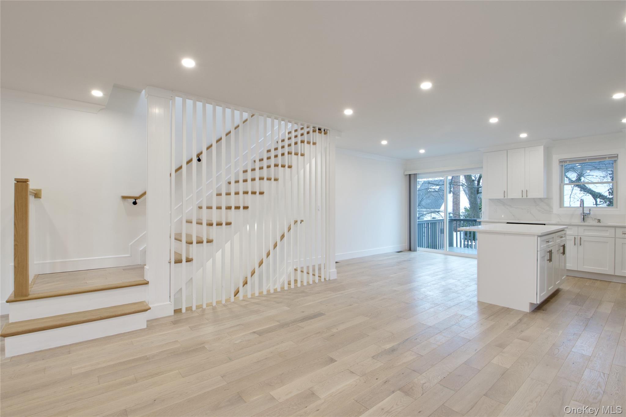 56 Kirkwood Road Port Washington, NY 11050 - Photo 8 of 46 a view of kitchen with cabinets and wooden floor