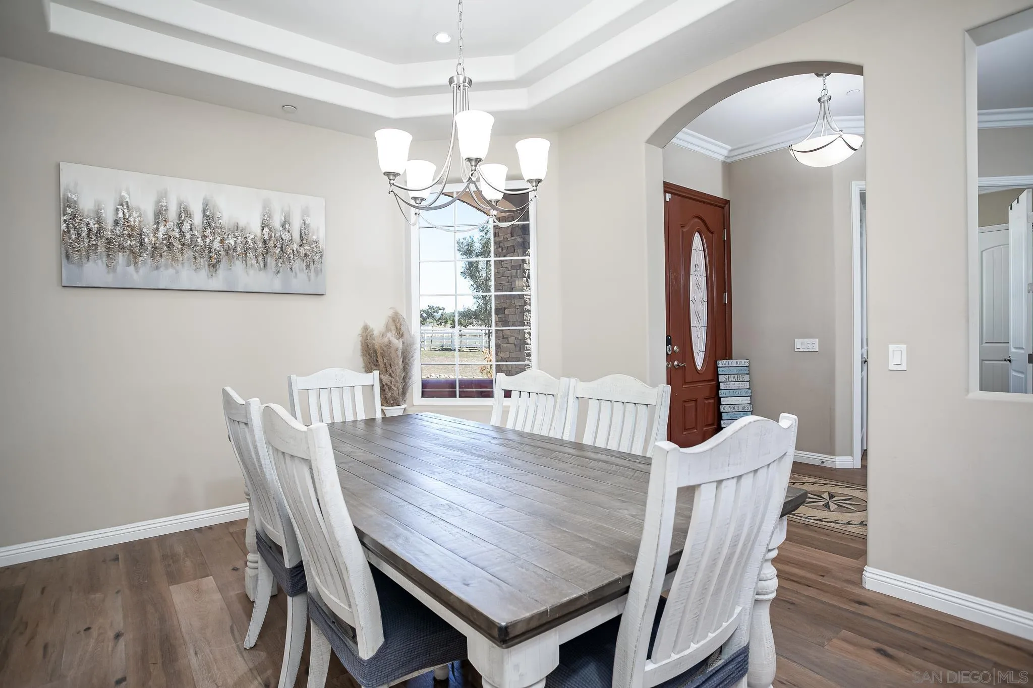 1090 Heritage Ranch Road Ramona, CA 92065 - Photo 14 of 49 a view of a dining room with furniture a chandelier and wooden floor