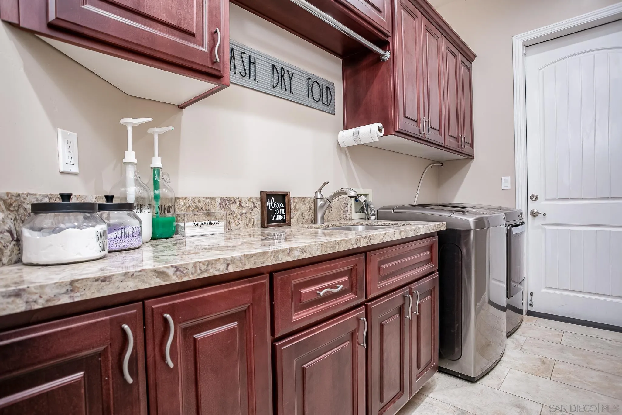 1090 Heritage Ranch Road Ramona, CA 92065 - Photo 17 of 49 a kitchen with granite countertop stainless steel appliances a sink and cabinets