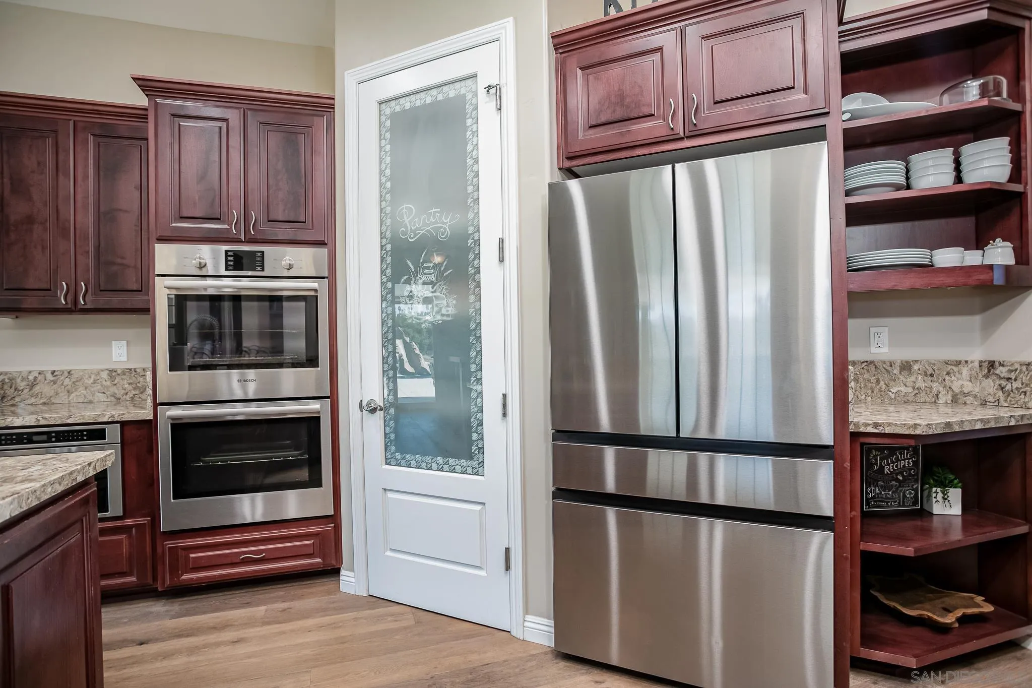 1090 Heritage Ranch Road Ramona, CA 92065 - Photo 19 of 49 a kitchen with stainless steel appliances granite countertop a refrigerator and a stove top oven