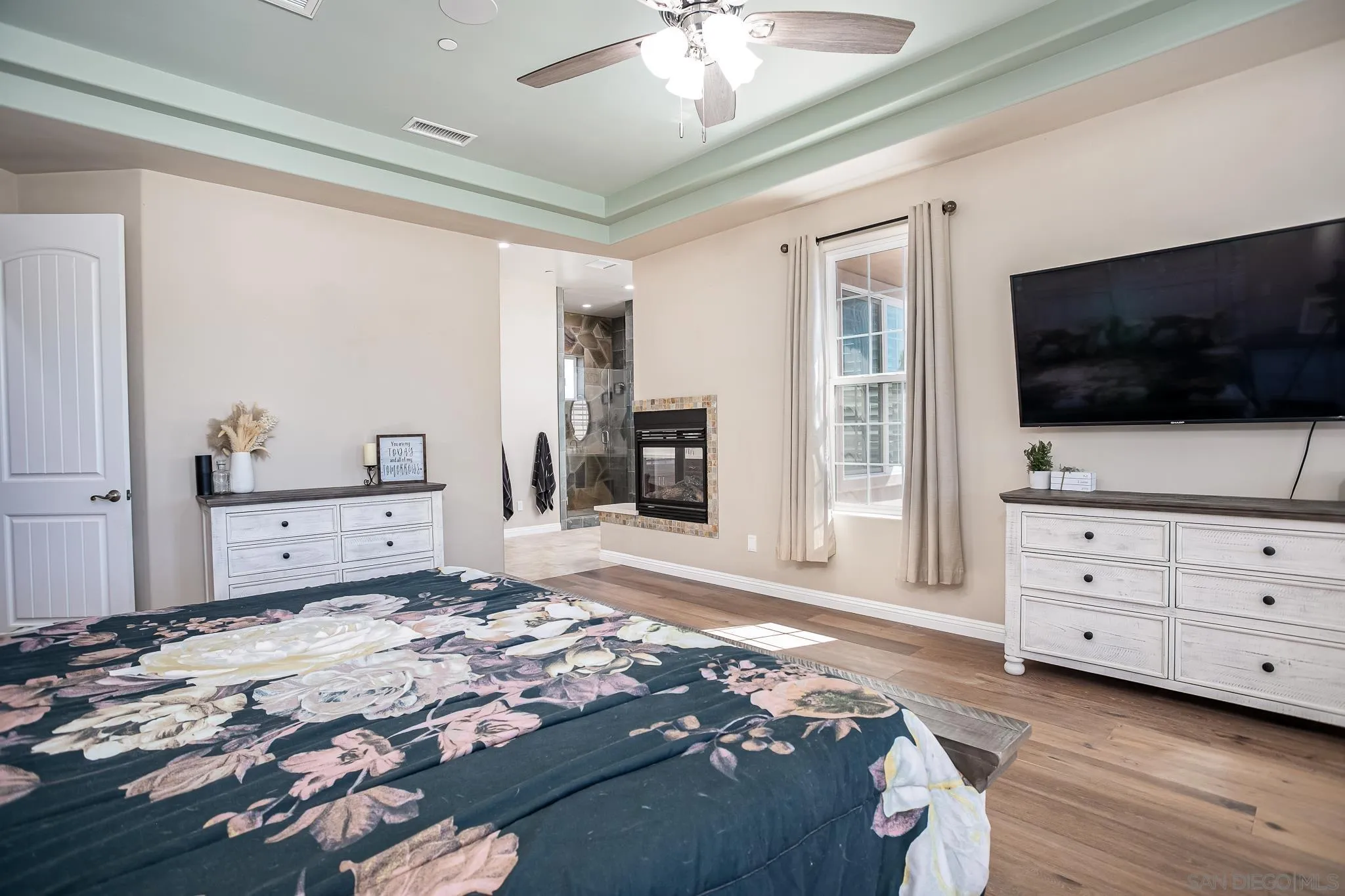 1090 Heritage Ranch Road Ramona, CA 92065 - Photo 22 of 49 a bedroom with a bed and flat screen tv