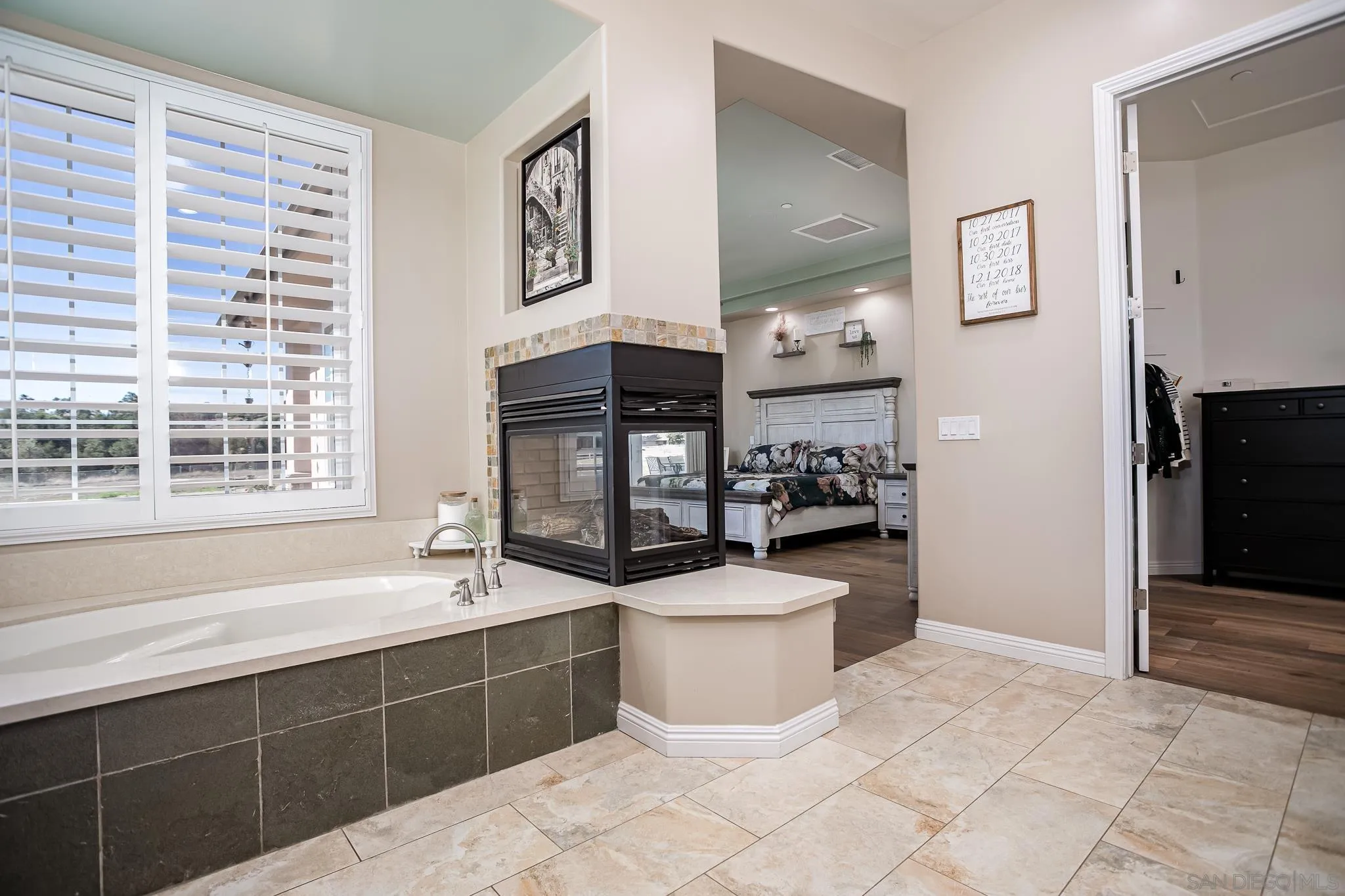 1090 Heritage Ranch Road Ramona, CA 92065 - Photo 23 of 49 a spacious bathroom with a bathtub sink and mirror