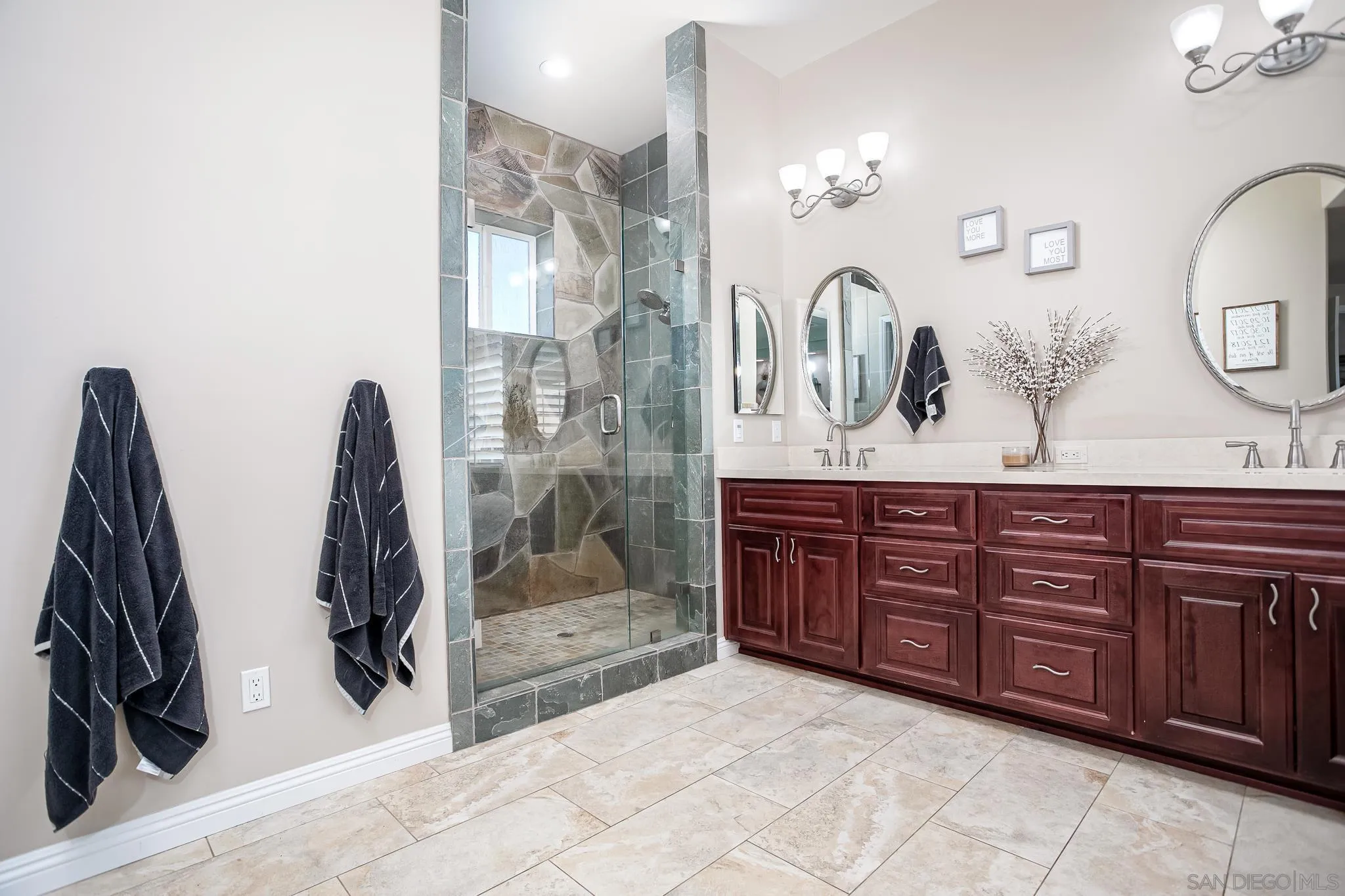 1090 Heritage Ranch Road Ramona, CA 92065 - Photo 24 of 49 a bathroom with a granite countertop sink a mirror and shower