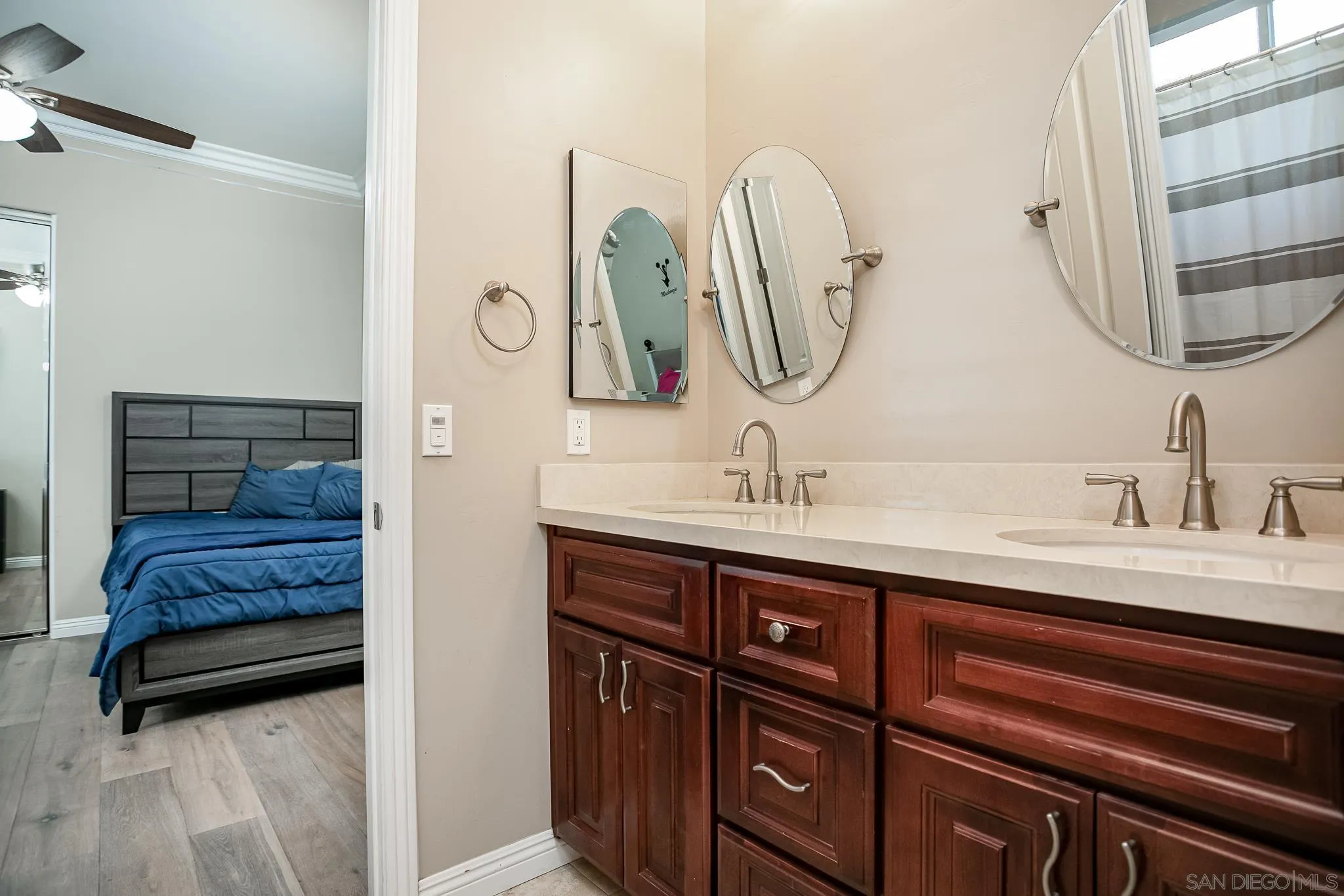 1090 Heritage Ranch Road Ramona, CA 92065 - Photo 27 of 49 a en suite bathroom with a double vanity sink and a mirror