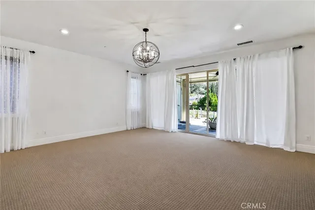 a view of a room with a large window